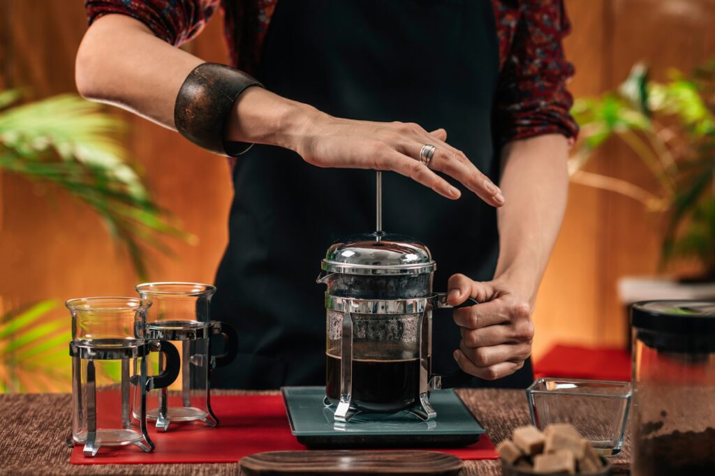 Barista Making French Press Coffee