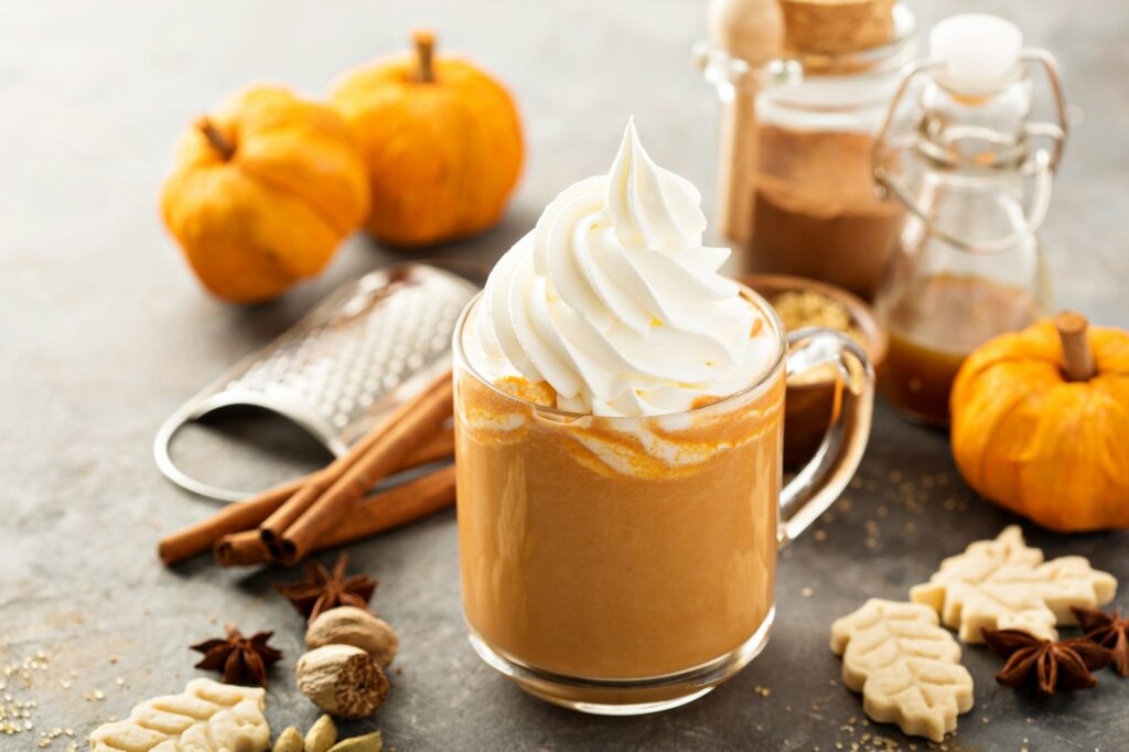 Pumpkin spice latte in a glass mug