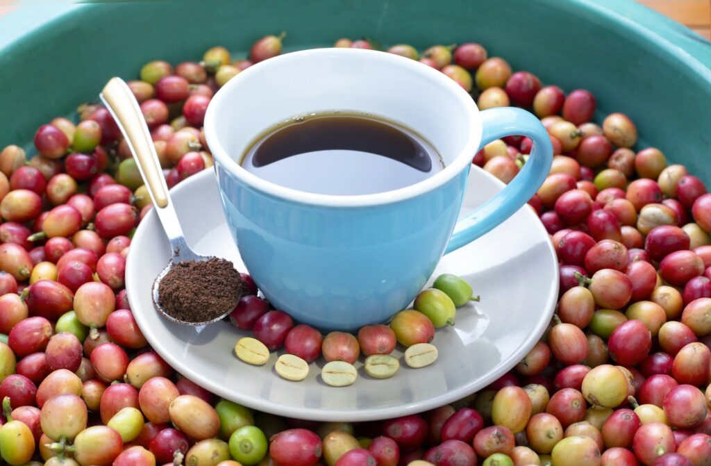 Shot of a cup of coffee with Colombian coffee beans - coffee making process